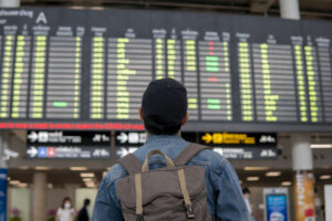 Passenger waiting at the airport after a flight delay to Dubai.